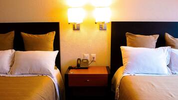 Standard Twin Room | Down comforters, desk, laptop workspace, blackout drapes