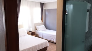 Premium bedding, free minibar, in-room safe, laptop workspace