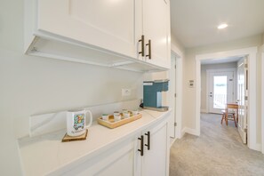 Enjoy cooking in this well-equipped kitchen with a stove and microwave.