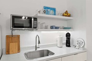 Fridge, microwave, stovetop, coffee/tea maker