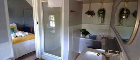 Family Suite | Bathroom | Hair dryer, slippers, towels, soap