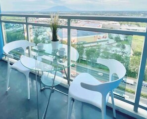 Outdoor dining - Light and Airy Staycation Studio in Azure North
(San Fernando)