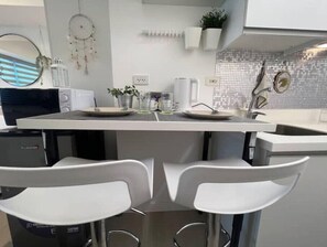 Private kitchen - Light and Airy Staycation Studio in Azure North
 (San Fernando)