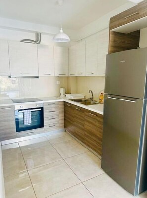 Fridge, microwave, oven, dining tables