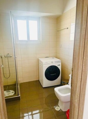 Shower, hair dryer, soap, shampoo
