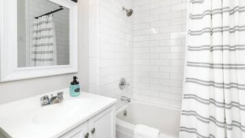 Shower, eco-friendly toiletries, hair dryer, towels