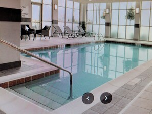 A swimming pool with lounge chairs and a lifeguard station. - Alabama - LSU Football - Suite  near Stadium  (Tuscaloosa)