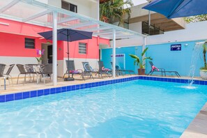 Outdoor pool, pool umbrellas, pool loungers