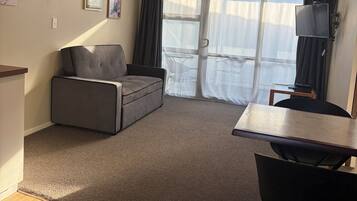 Basic Room, 1 Bedroom | Living area | 1-inch flat-screen TV with cable channels