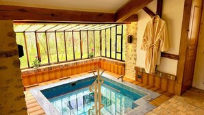 A room with a glass-enclosed hot tub, wooden beams, and a wooden bench. - Elegant Mill Compound, 1 hr from Paris. Sleep 20, Events for 50 - an extra fee. (Méréville)