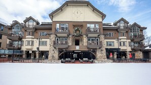A multi-story hotel with a central entrance, stone facade, and multiple balconies. - 2BR ski-in/out condo in Beaver Creek Village with mountain views (Beaver Creek)