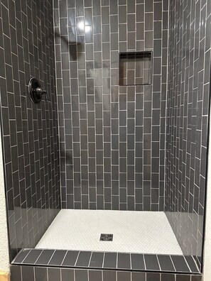 Shower, hair dryer, towels, toilet paper