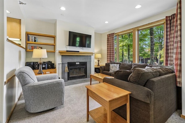 Comfortable Fireside Living Room - Settle in beside the fireplace with plenty of seating for relaxing together after a day on the mountain.
