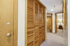 Hallway Storage - Generous closet space provides convenient storage for luggage, clothing and gear during your stay. - Make Yourself at Home D18 (Killington)