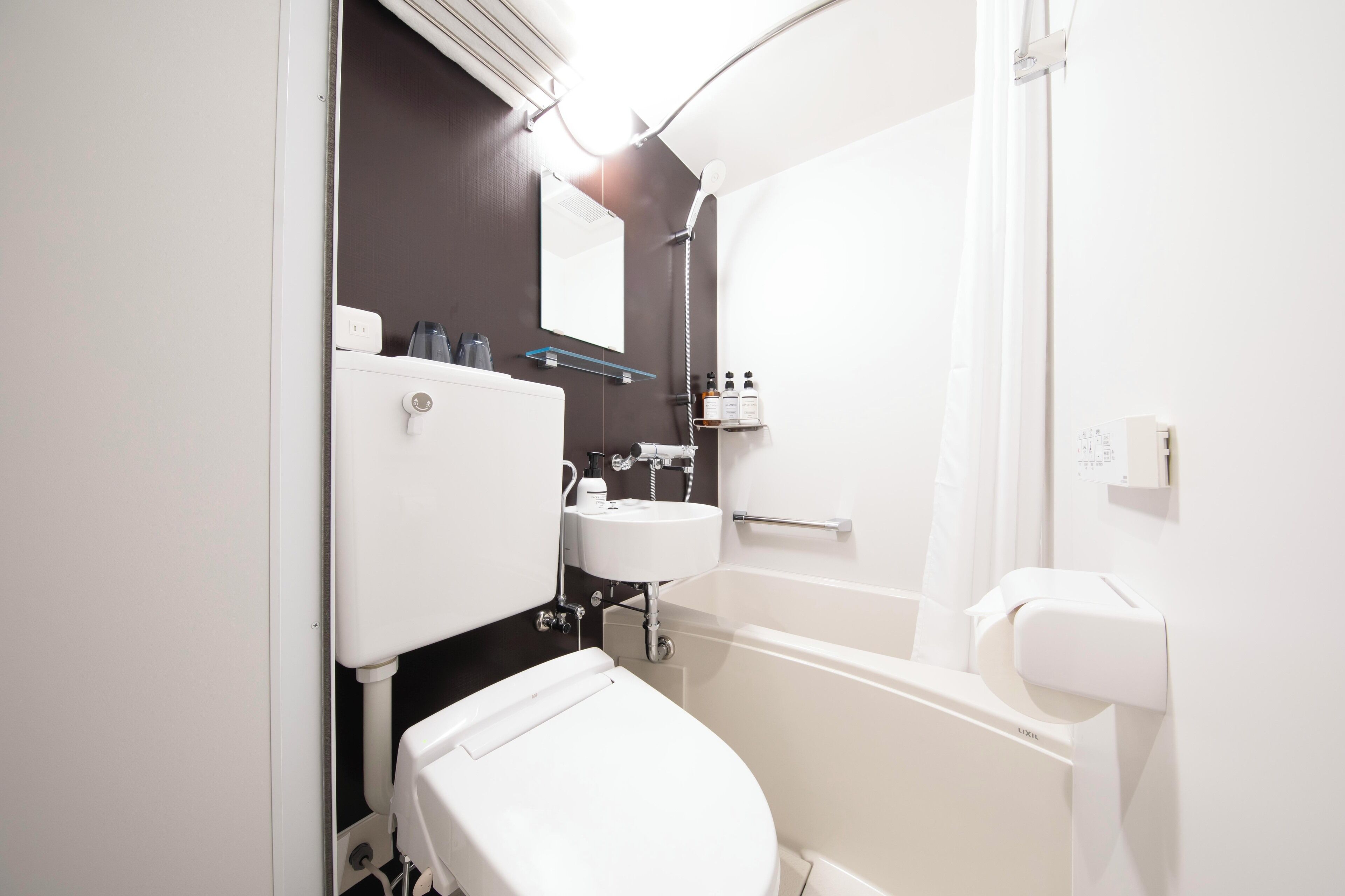 Combined shower/tub, free toiletries, hair dryer, slippers