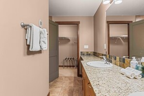 Bathtub, hair dryer, towels, soap