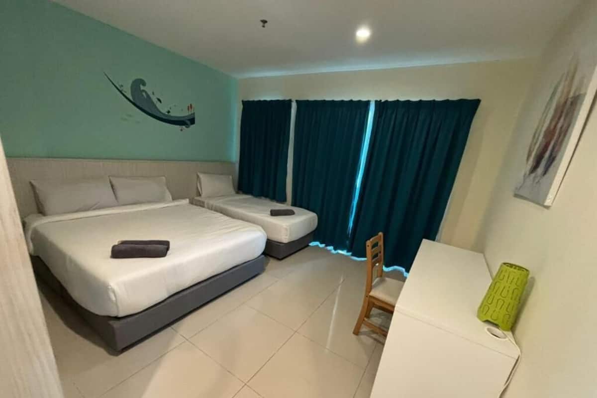 Superior Triple Room | Desk, blackout drapes, iron/ironing board, bed sheets