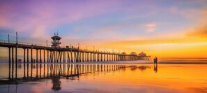 Guests can stroll along the pier, taking in the serene views of the surrounding water.