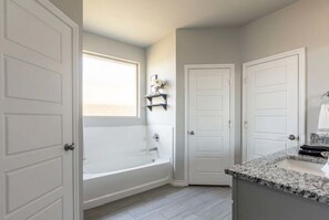 Shower, hair dryer, towels, shampoo