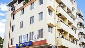A multi-story building with a sign for 'SILA' and 'fab hotels' on the ground floor. - Fabhotel Celebrity Layout (Bengaluru)