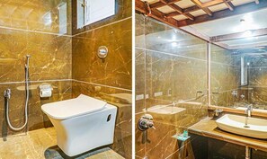 Habitación Deluxe | Baño | Ducha y cabezal de ducha tipo lluvia