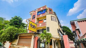 A multi-story building with a sign for 'Tab Hotels'. - Fabexpress Jai Manglam Service Apartment (Nagpur)