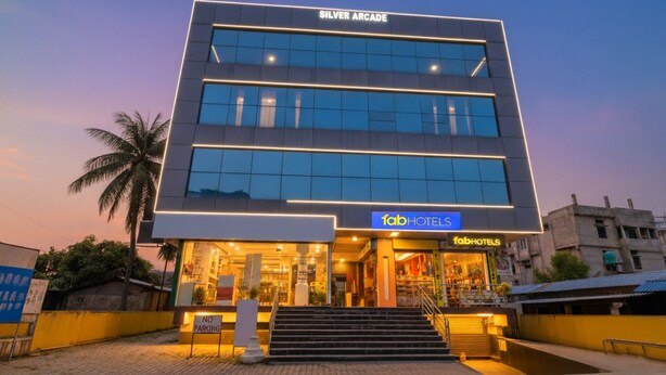 A modern hotel with a "Silver Arcade" sign, a "fabHOTELS" sign, and a "No Parking" sign. - FabHotel Penthouse (Guwahati)