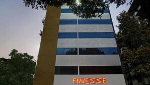 A modern building with a sign reading "FINESE" on the facade. - Fabhotel Prime Finesse (Pune)