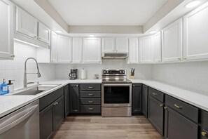 Fridge, microwave, stovetop, coffee/tea maker