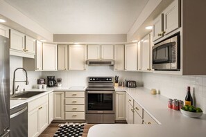 Fridge, microwave, stovetop, coffee/tea maker