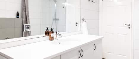 Shower, hair dryer, towels, soap