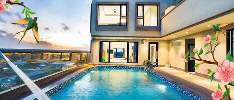 Outdoor pool, open 6:00 AM to 6:00 PM, pool umbrellas, pool loungers