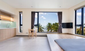 Family Room, Multiple Beds, Sea View | Premium bedding, individually furnished, desk, soundproofing - The Rebirth Apartment Binh Chau Ho Tram (Ho Chi Minh City)