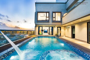 Outdoor pool, open 6:00 AM to 6:00 PM, pool umbrellas, sun loungers