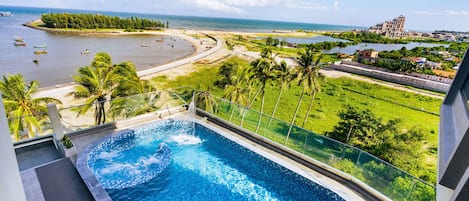 Outdoor pool, open 6:00 AM to 6:00 PM, pool umbrellas, pool loungers