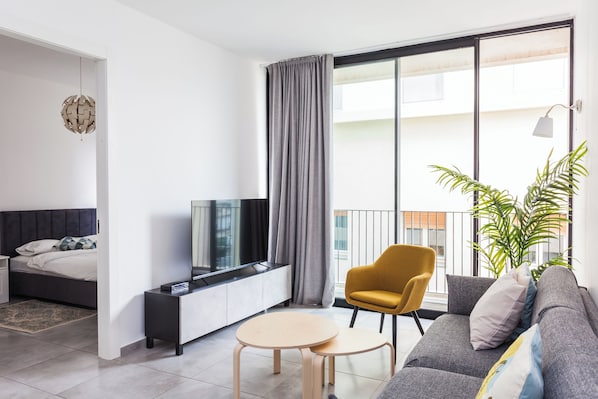 Apartamento luxo | Área de estar | TV de tela plana
