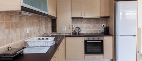 Apartment | Private kitchen | Full-size fridge, oven, toaster, cookware/dishes/utensils