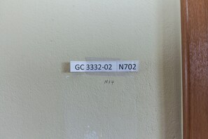 A wall with a label reading "GC 3332-02 N702" and a handwritten "N17".