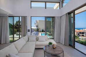 Deluxe Villa, Private Pool, Sea View | Living area | 55-inch Smart TV with satellite channels, Netflix, streaming services - Villa Manu Luxury Living (Chania)