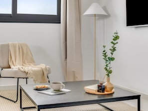 Appartement, 1 slaapkamer, balkon, uitzicht op de stad | Woonkamer