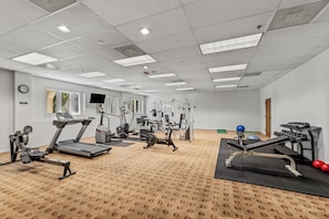 A gym with treadmills, stationary bikes, and weight machines. - Luxury Mountain Escape| The Terraces at EagleRidge! (Steamboat Springs)