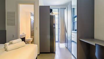 Desk, laptop workspace, free WiFi, bed sheets