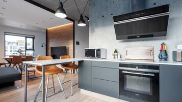Luxury Apartment | Private kitchen | Full-sized fridge, microwave, oven, stovetop