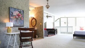 A spacious room with a dining area, a bed, and a large window. - Heroes Boulevard House with room for up to ten (Lawton)