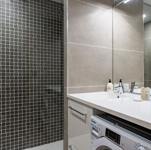 Shower, hair dryer, towels, soap