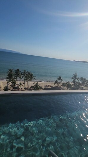 Enjoy a refreshing swim in our pool overlooking the ocean and beach.
