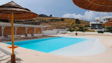Outdoor pool, pool umbrellas, pool loungers