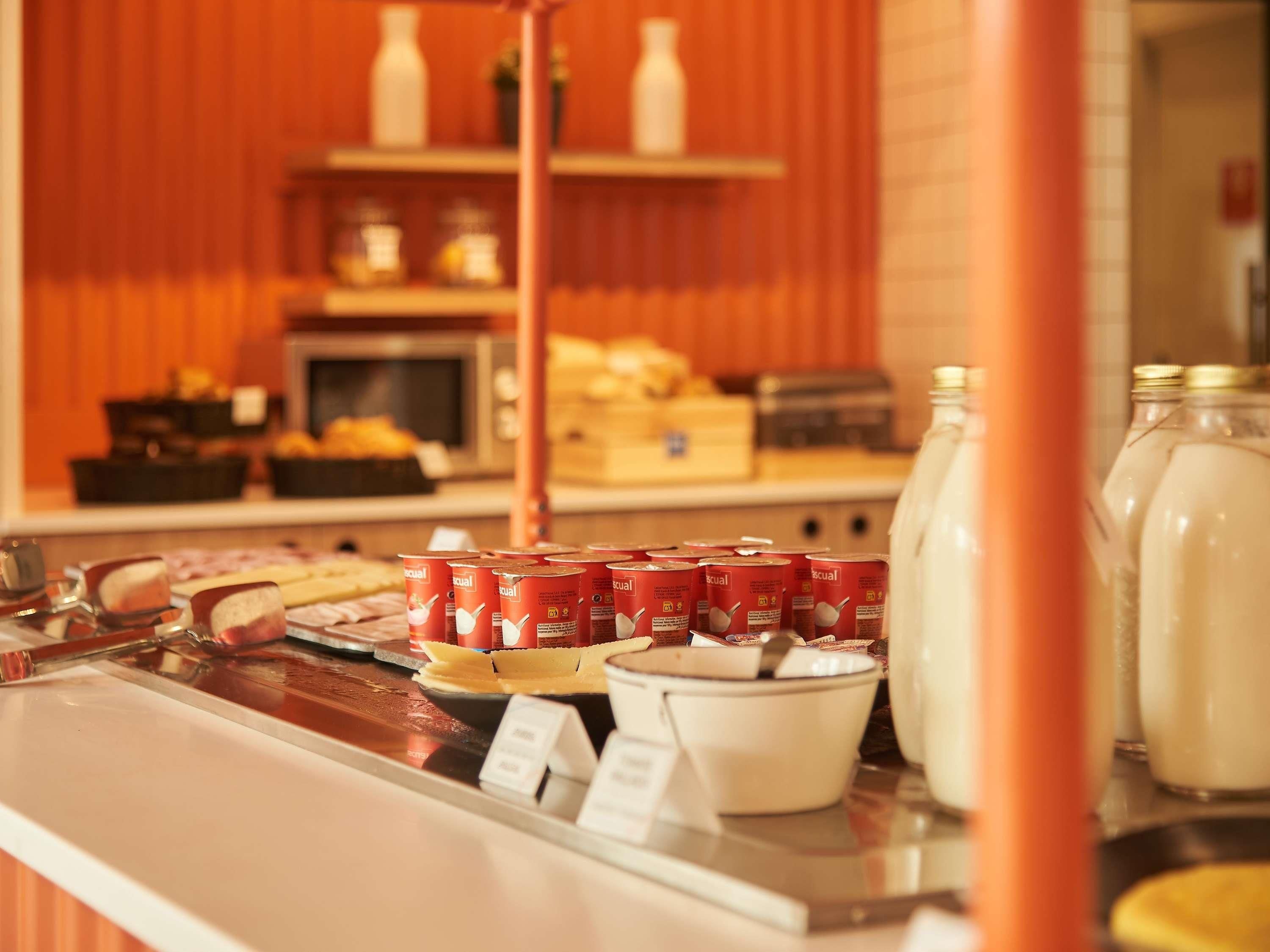 A breakfast buffet with various food items and beverages.