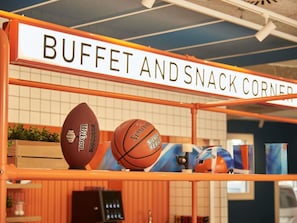 A sports equipment display with a sign reading 'BUFFET AND SNACK CORNER'. - Ibis Budget Vitoria Gasteiz (Vitoria-Gasteiz)