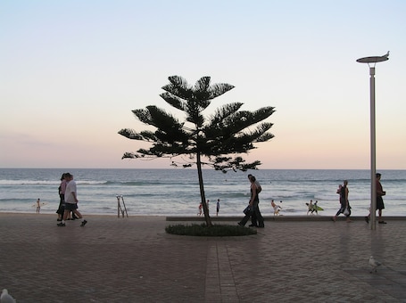 On the beach, white sand, sun loungers, beach umbrellas